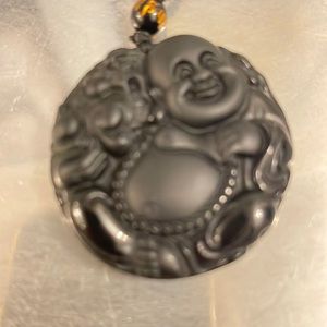 Black Buddha necklace on a beaded string. 20 inches long. Very sturdy!!!